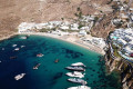 As the docked yachts suggest, Super Paradise beach attracts jet-setters in Mykonos all summer