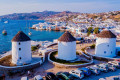 Magnificent view of Chora in Mykonos, with the ever-present windmills prominently shown