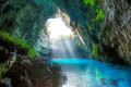Morning light entering from the top of cave Melissani in Cephalonia
