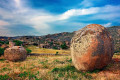 Smooth rocks create a surrel landscape in the village of Volakas, Tinos