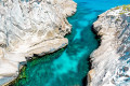 Stunning view of the blue-green sea and white rocks of Sarakiniko beach in Milos