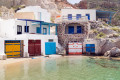 Houses in the fishing village of Klima have doors in the water to accommodate boats