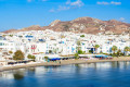 The beach of Agios Georgios and Chora in Naxos behind it