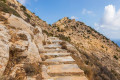 The stone mountain path to the Byzantine Castle remains in Ios