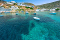 The coast near the village of Cheronissos in Sifnos features crystal-clear azure waters