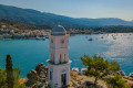 The iconic clock tower decorating the waterfront of Poros