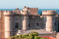 The Palace of the Grand Master in Rhodes as the sun sets on the island