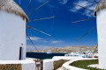 A view of Chora in Mykonos through two Cycladic windmills