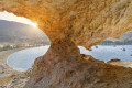 Petra beach in Patmos seen through a nearby cave