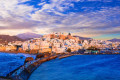 Chora in Naxos as seen from the wave crasher that surrounds the port