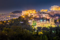 The Roman Theater and the Acropolis lit up during a summer night