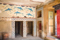 The doorway that is decorated with the dolphin fresco