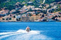 As you are approaching Spetses by boat