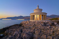 As the sun sets in Cephalonia, the view of the Argostoli lighthouse is spectacular