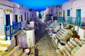 Traditional street full of two-story Cycladic houses in Chora, Folegandros