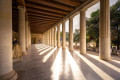 Columns in the Stoa of Attalos as sunbeams squeeze through them