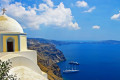 View of the Santorinian caldera dn the church of Saint John the Theologian in Fira