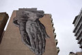 Praying hands graffiti in downtown Athens