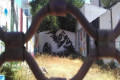Graffiti in a yard in Metaxourgio