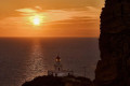 Sunset on the lighthouse of Akrotiri in Santorini