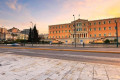 The Greek Parliament on Syntagma Square as the sun sets on Athens