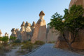 Stony landscape with the fairy chimneys rising from the ground in Goreme