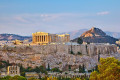 The sun prepares to set on the Acropolis on a fine spring day