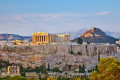 Sunset on Athens with the Acropolis casting a glance over the city