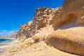 Wild rock formations on the beach of Vlychada in Santorini