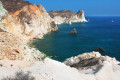 The White Beach in Santorini features wild rock formations
