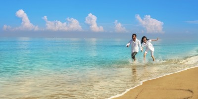 Happy couple by the beach