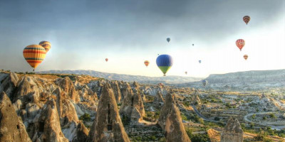 Hot air ballons above a gorgeous landscape in Cappadocia