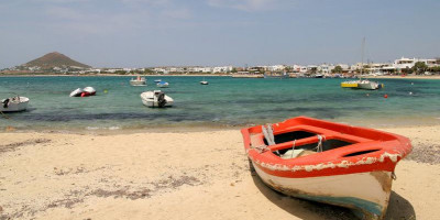 Red fishing boat on the beach in Naxos