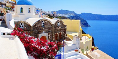 Candy colored houses and the exotic caldera, Santorini island
