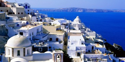 Elevated view of the sugar cubed houses and the vivid blue sea, Santorini island