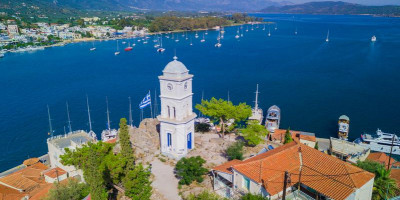 The iconic clock tower in the main port of Poros