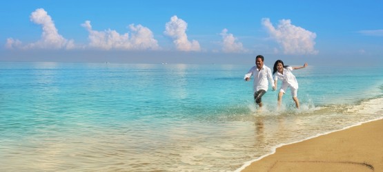 Happy couple by the beach