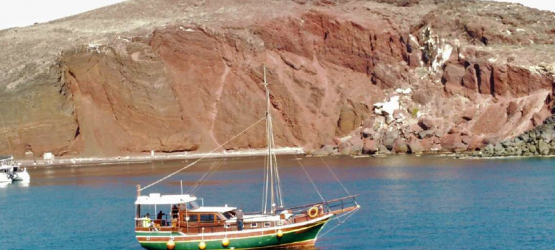 The traditional caique that trakes you around Santorini The traditional caique that trakes you around Santorini