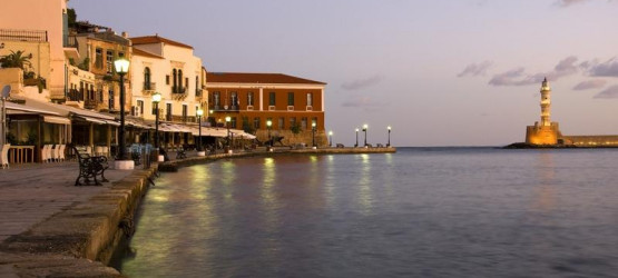 Chania's old port and lighthouse early in the morning Chania's old port and lighthouse early in the morning