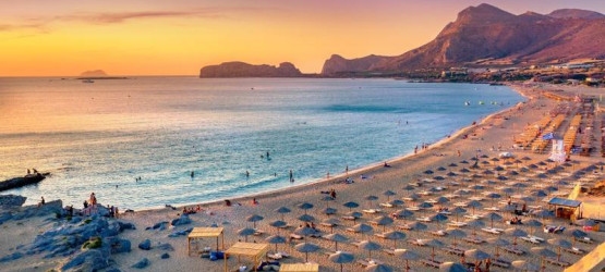 A magnificent golden hue fills the sky as the sun sets