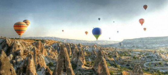 Hot air ballons above a gorgeous landscape in Cappadocia