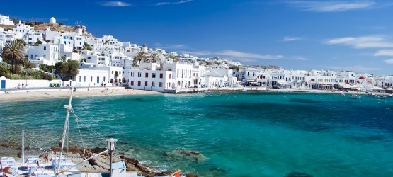 Beautiful bay with turquoise waters encircling the white washed buildings, Mykonos island