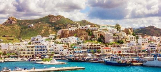 Blue sea and houses at the port, Naxos island Blue sea and houses at the port, Naxos island
