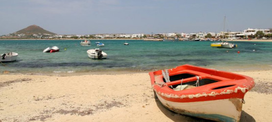 Red fishing boat on the beach in Naxos