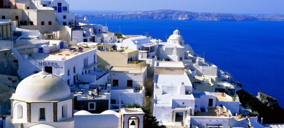 Elevated view of the sugar cubed houses and the vivid blue sea, Santorini island
